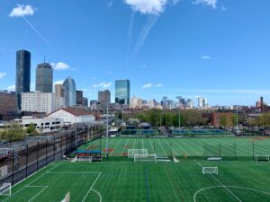 Northeastern Boston athletic fields. Blog graphic for 4 immediate things to do if looking to go to college. awomansoutlook.com