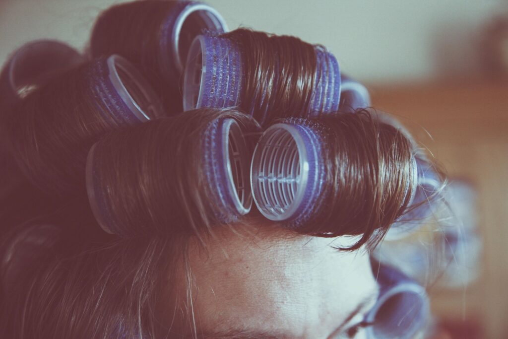 Rollers in hair. Blog graphic for a blog post  for awomansoutlook.com
