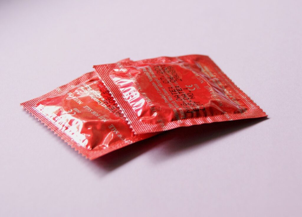 red condoms, contraception, contraceptives-849407.jpg. Blog graphic for blog post at awomansoutlook.com
