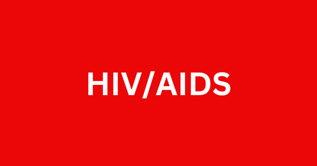 The words HIV/AIDS are in white lettering and in the center of a red rectangle. Was graphic for blog post 7 hard facts everyone needs to know about HIV post at awomansoutlook.com